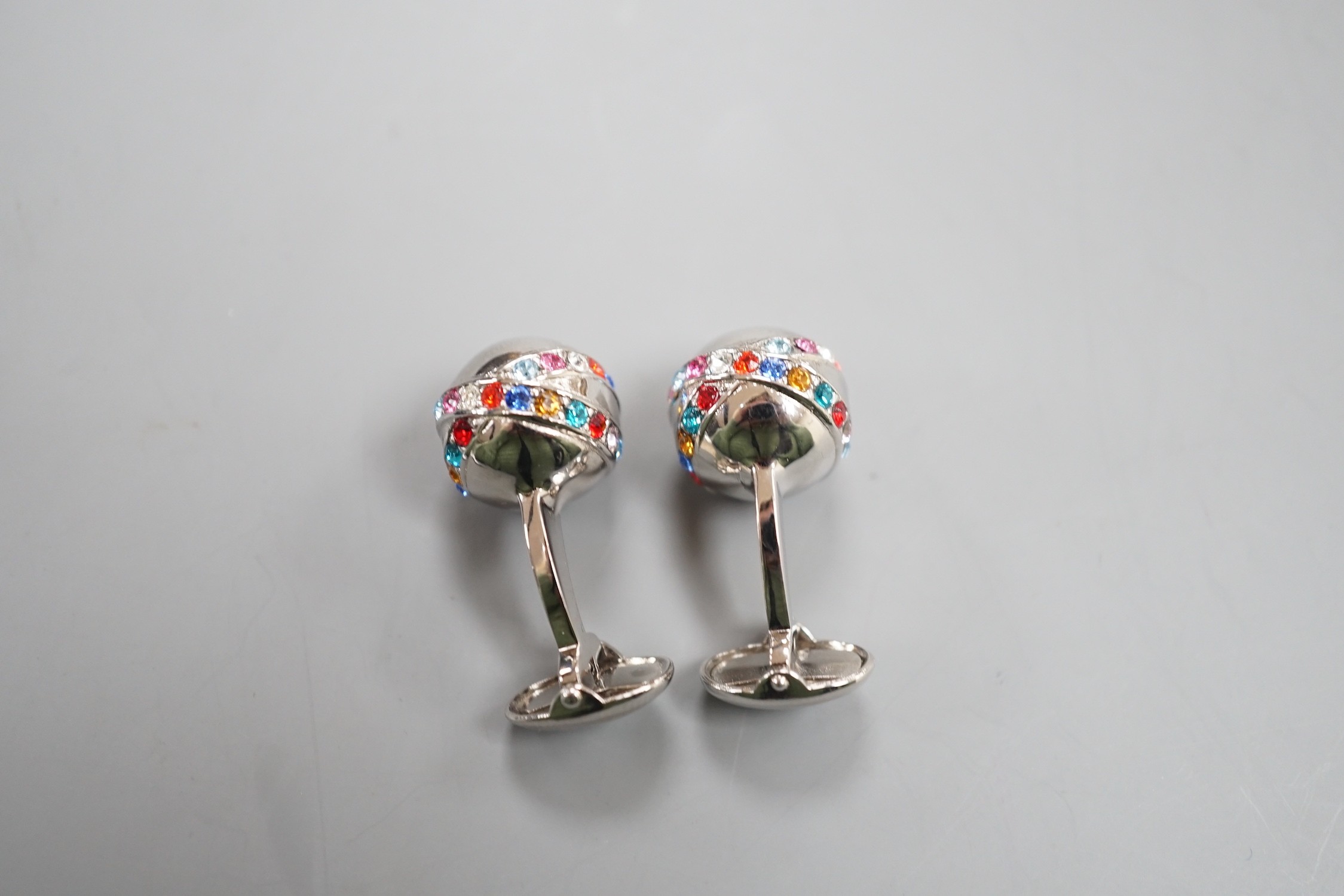 A modern pair of metal and coloured paste set cufflinks.
